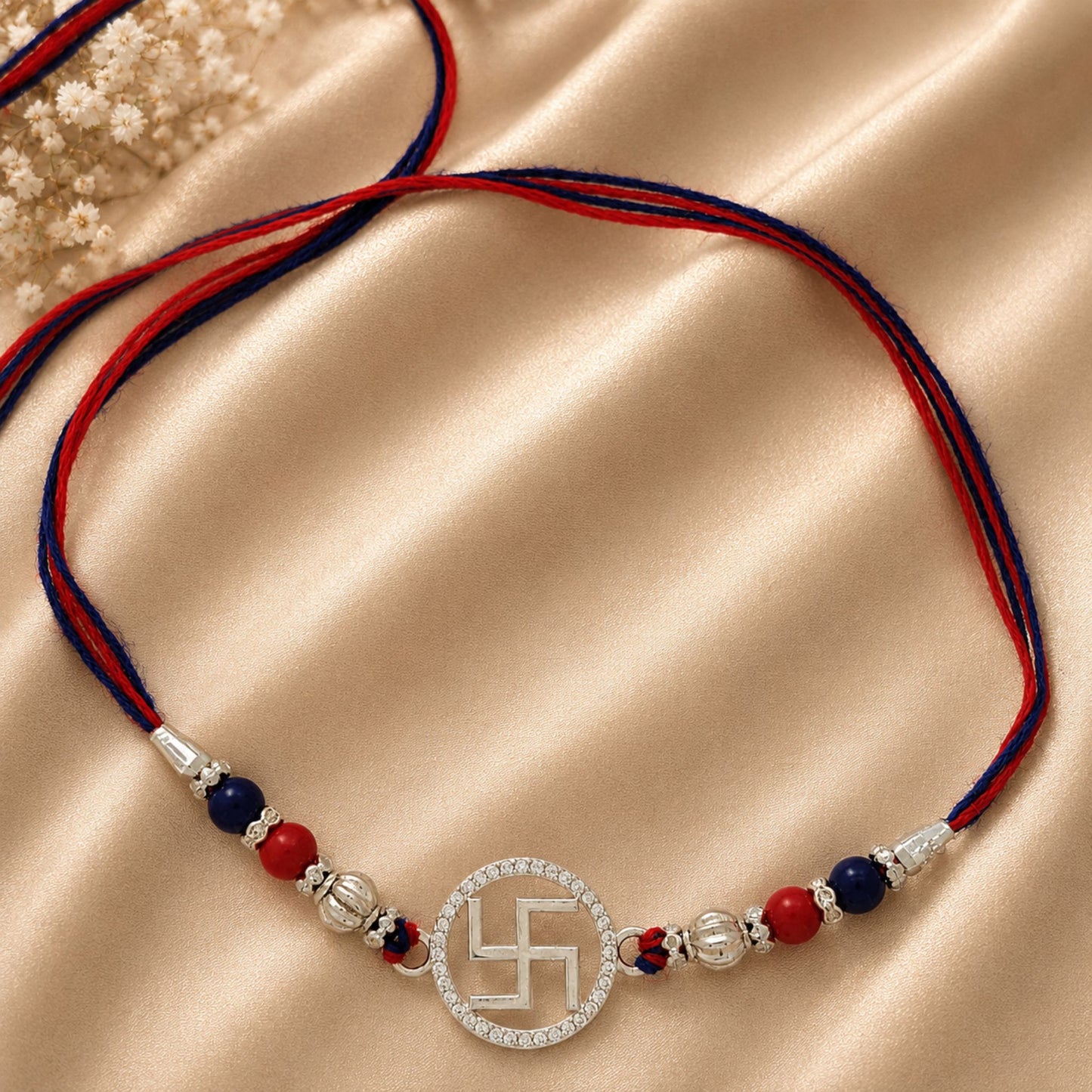 Sacred Swastik Silver Rakhi with Sparkling CZ Elegance