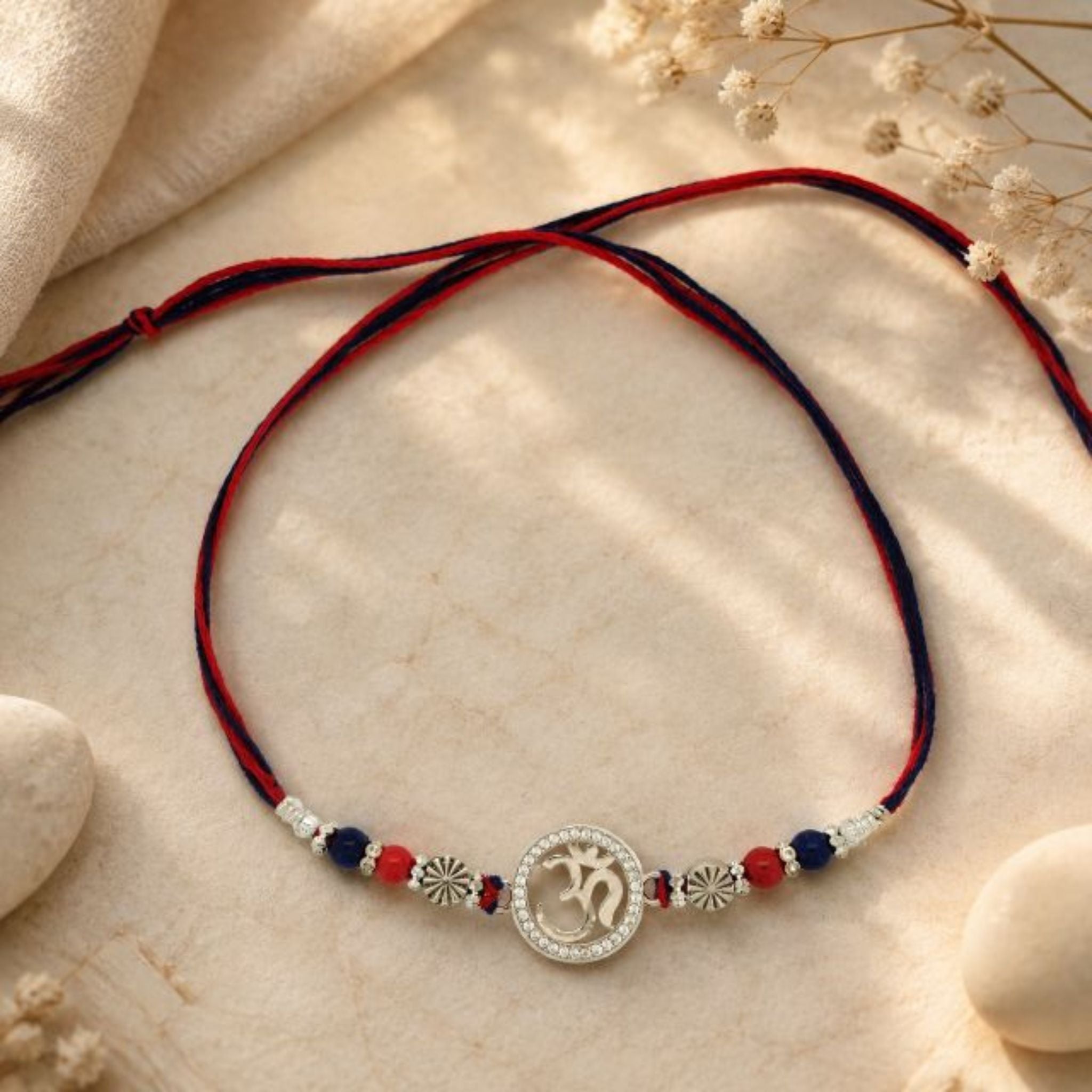 Elegant Om Rakhi with Sparkling Sterling Silver Charm