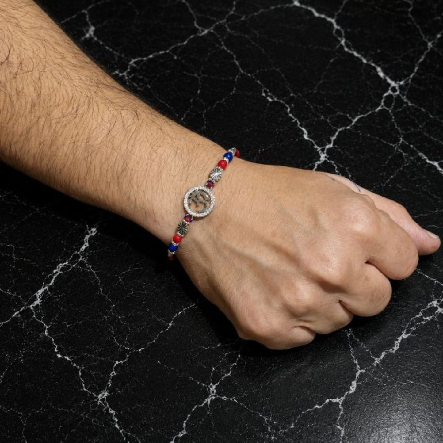Elegant Om Rakhi with Sparkling Sterling Silver Charm
