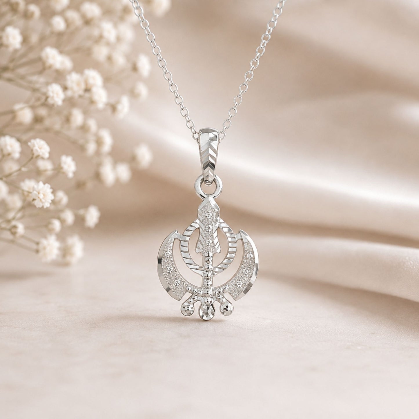 Elegant Khanda pendant with brilliant diamond-cut detailing