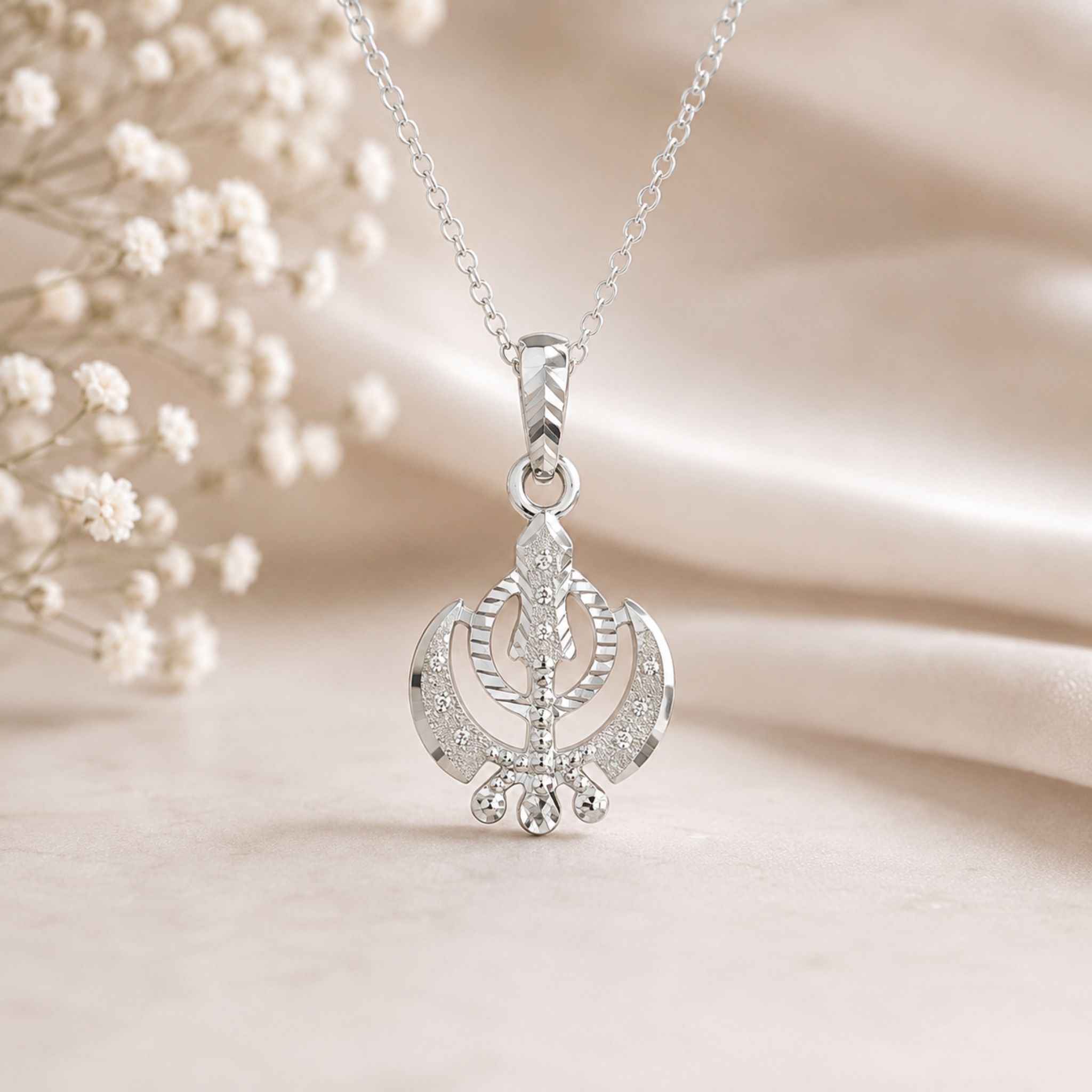 Elegant Khanda pendant with brilliant diamond-cut detailing