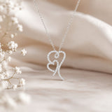 Interlocking heart pendant adorned with sparkling lab-grown diamonds