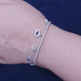 925 Sterling Silver Tennis Bracelet with Floral & Evil Eye Charm Accents